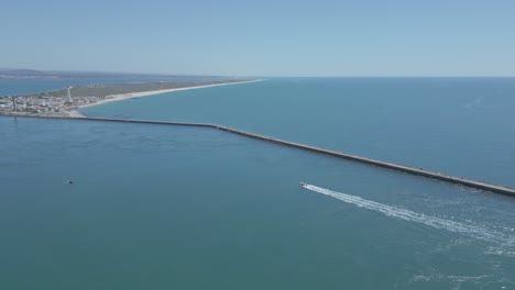 speeding boat carrying tourists to a deserted island in the algarve