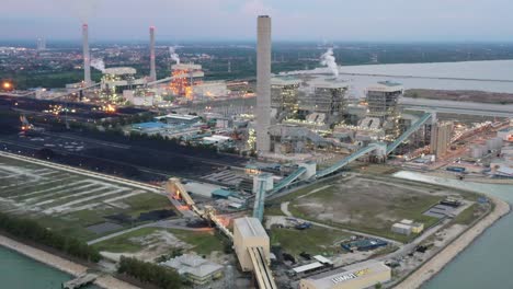 Leading-shot-from-the-conveyor-belt-to-ultra-supercritical-coal-fired-power-plant-by-Tenaga-Nasional-Berhad-TNB-located-at-artificial-island,-manjung,-perak,-malaysia,-southeast-asia