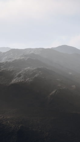 dramatic mountain range with fog