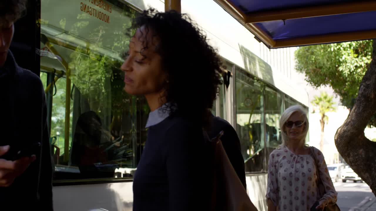 Couple interacting with each other at bus stop 4k