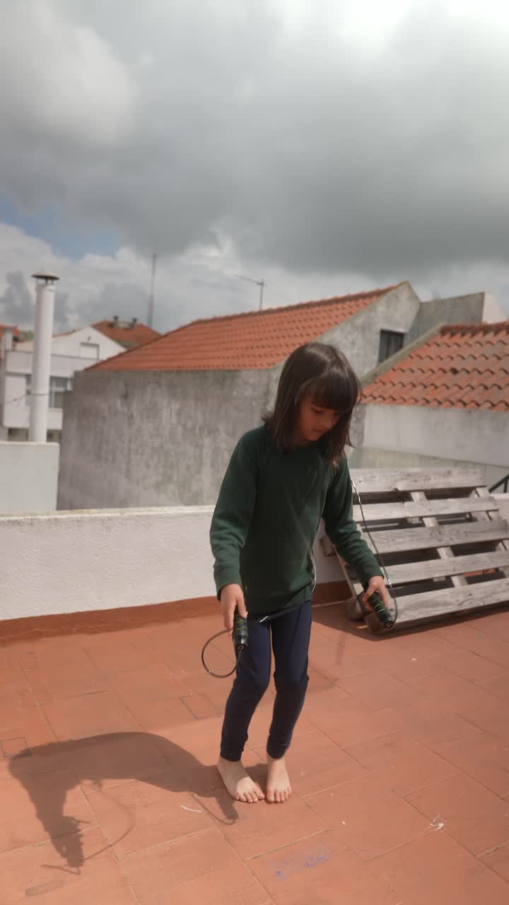 Girl Jumping Rope on a Rooftop