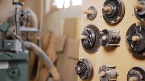 working on the old grinding machine at the carpentry