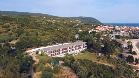 flying over road and hotel on the beach shore in ouranoupoli