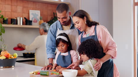 Family,-children-and-cooking-vegetables-in-kitchen
