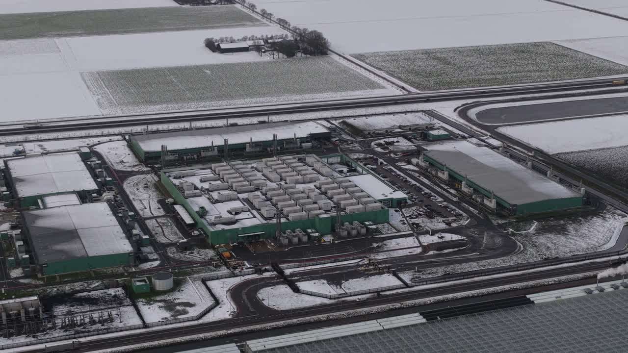 Aerial drone close up views of data center emergency power backup systems and HVAC cooling infrastructure in the Netherlands, highlighting critical energy reliability and climate control for digital o