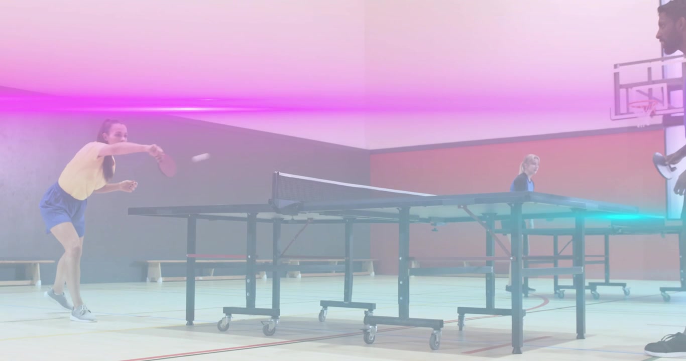 Woman dropping ball and striking paddle until partner stepping in launching table tennis rally