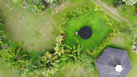 off grid home viewed from above with water tank and hexagon design home