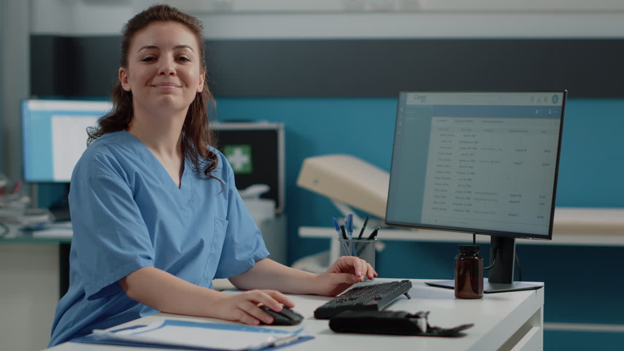 Nurse working on computer in hospital office