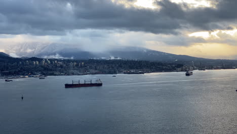 View-of-a-stormy-sky-over-Vancouver-harbor,-Canada,-with-ships-passing-by