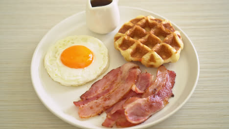 fried egg with bacon and waffle for breakfast