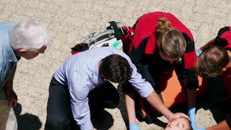 paramedics examining injured girl