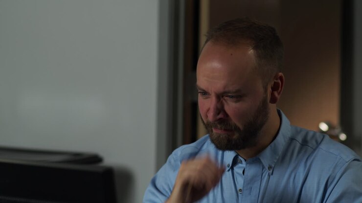 Male office worker celebrates completing a job