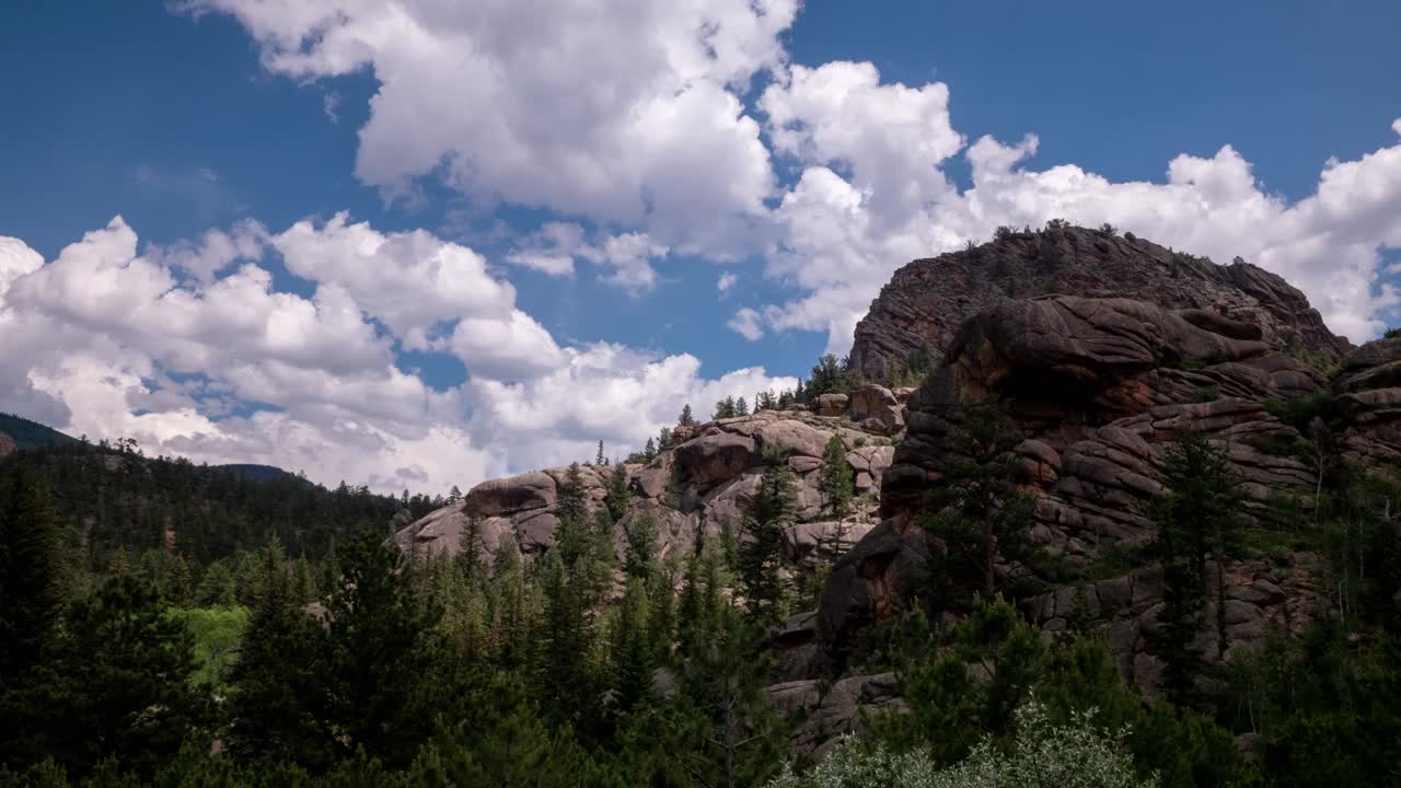 Time lapse of clouds and a big rock in the mountains of Colorado