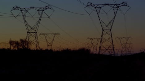 Animation-of-financial-data-processing-over-electric-pylons-in-countryside