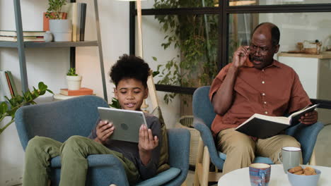 black man and boy in the living room