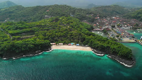 wide aerial overview of the bias tugel beach and padang bai port, east bali