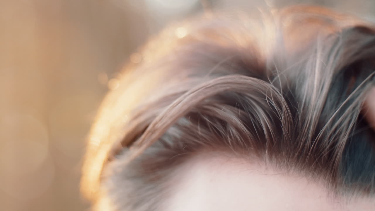 Close-up of a Person's Hair in the Sunlight