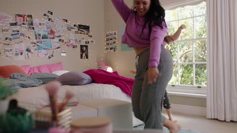 happy teenage girls dancing in bedroom best friends having fun enjoying crazy dance celebrating vacation weekend at home wearing pajamas