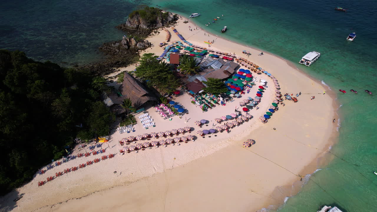 Static, high angle drone shot of the Koh Khai Nok island, sunny day in Thailand