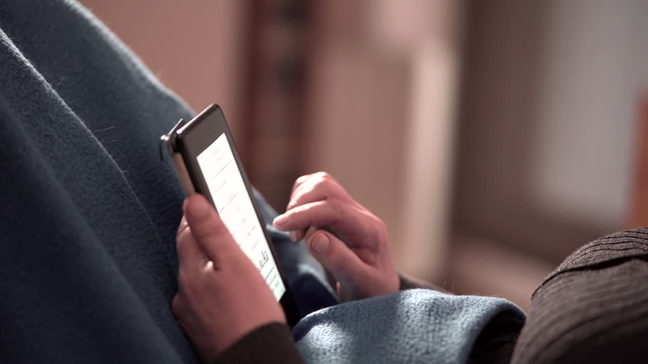 Person Reading on an Ebook Reader