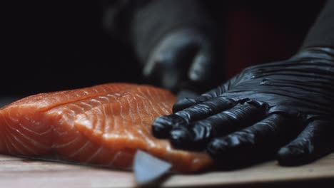 chef preparing salmon sashimi