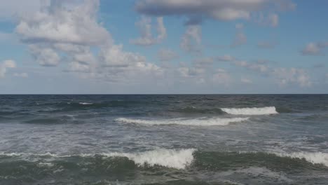 up-close-aerial-of-waves-as-the-break-towards-the-shore