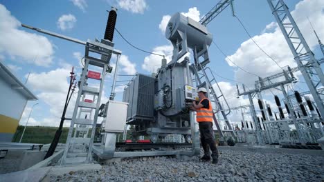 electrical engineers inspect the electrical systems at the equipment control cabinet