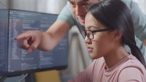 two people collaborating on a coding project