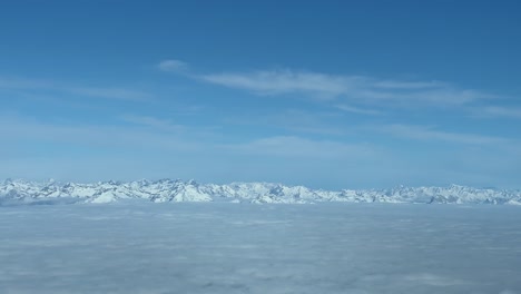 Jet-cockpit-view-of-the-snowed-NE-italian-Alps-flying-northbound