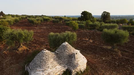 Aerial-landscape-view-over-traditional-trulli-stone-historic-buildings,-in-Italy