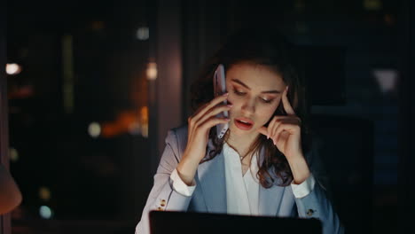 unmotivated office manager calling at office late evening close up. tired woman