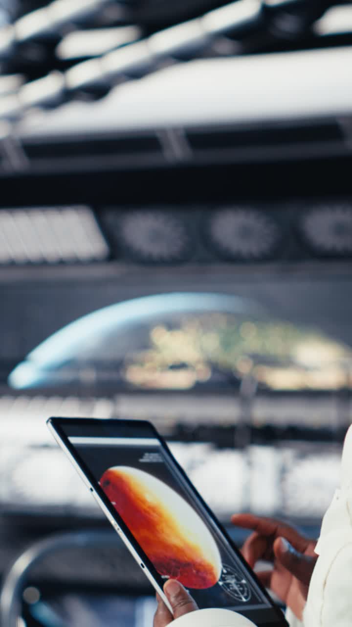 Vertical video Laptop inside high tech spaceship displaying Mars planetary surface analytics