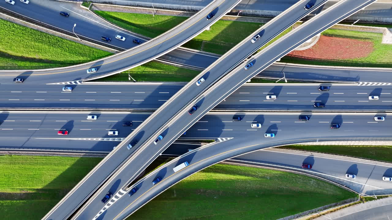 Aerial Time Lapse of Busy Highway Interchange with Moving Cars