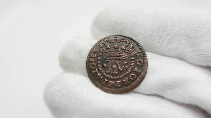 Monete antiche. Moneta portoghese di rame 33