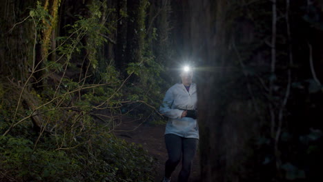 fit sportsmen running on trail in nature at dusk