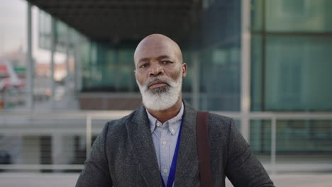 portrait of serious african american ceo businessman looking confident ready for business meeting in city