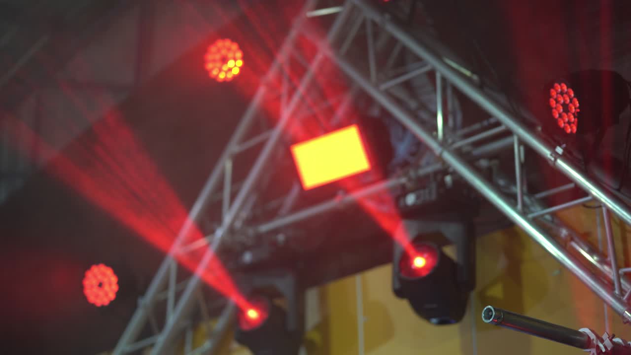 Colorful light led in scene stadium concert on night party, multicolor abstract box light for entertain, spotlight on stage show, red purple and orange bright color rays on event