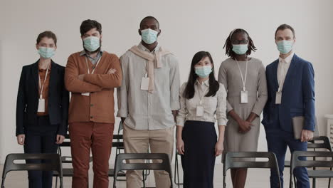 diverse businesspeople in masks posing
