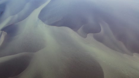 Aerial-birds-eye-shot-of-Olfusa-River-with-pattern-during-sunlight-in-Iceland,Europe