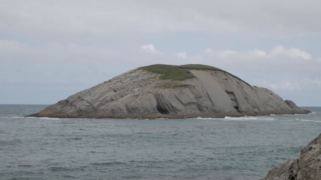 Rocky island off the coast of Covachos beach, Castro Island, Santa Cruz de Bezana