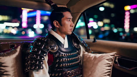 asian man in armor riding in a car at night