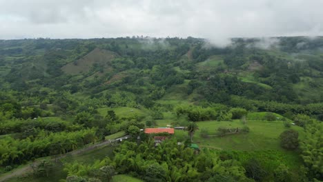 Aerial-Flying-Over-Finca-Colombian-Ranch-With-Swimming-Pool-On-Hilltop