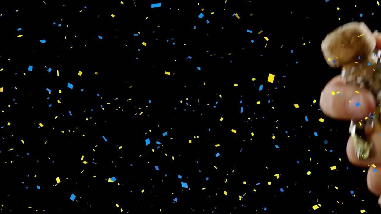 검은 바탕에  ⁇ 페인을 열고 있는 남자 위에 있는 콘페티의 애니메이션