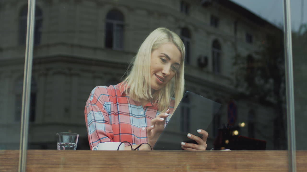 Attractive Woman Sitting In A Cafe