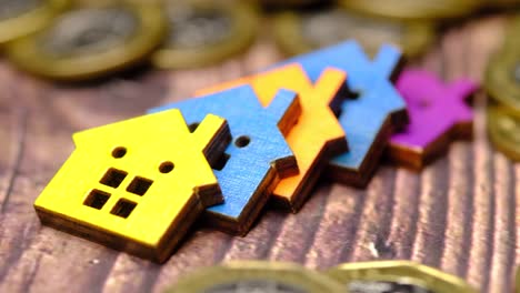 colorful wooden houses and coins