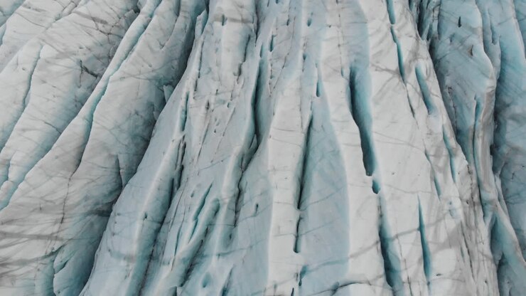 Glacier in Highlands of Iceland, Birdseye Aerial View of Blue Ice