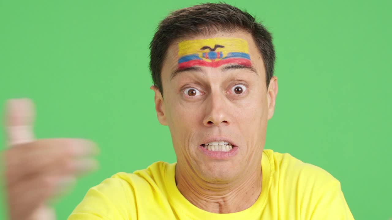 Man with ecuadorian national flag upset with a referee