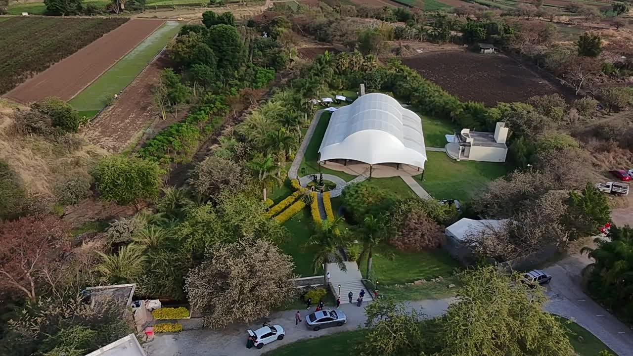 Aerial view of Jardin Villa Cortes venue in Morelos, with guests arriving at a wedding celebration