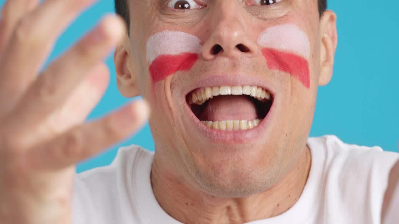 Very nervous man supporting polish team during a difficult match