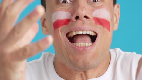 very nervous man supporting polish team during a difficult match